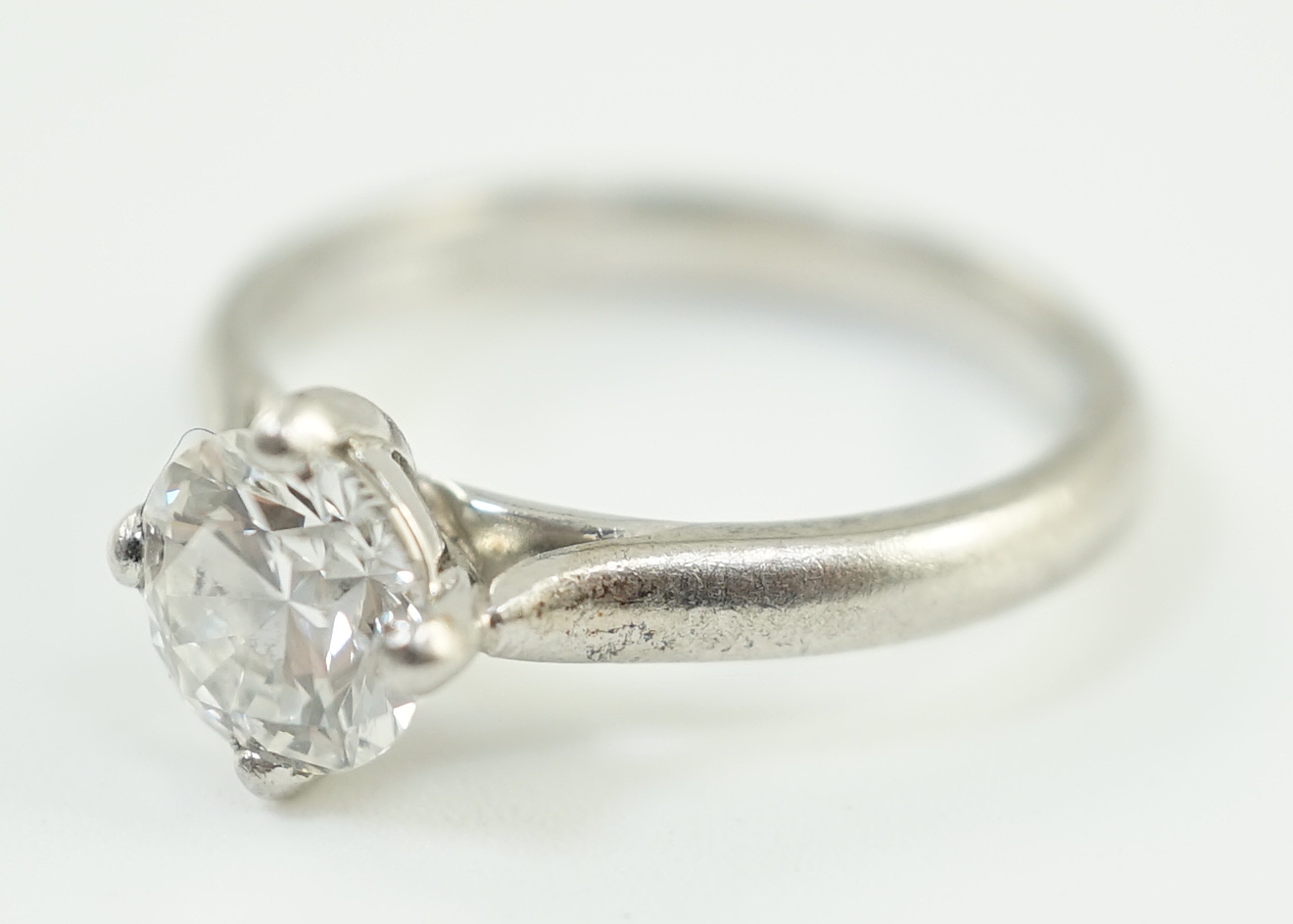 A modern platinum and solitaire diamond set ring